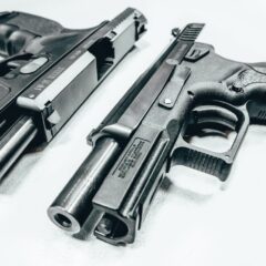 Photo of 2 silver semi-automatic firearms