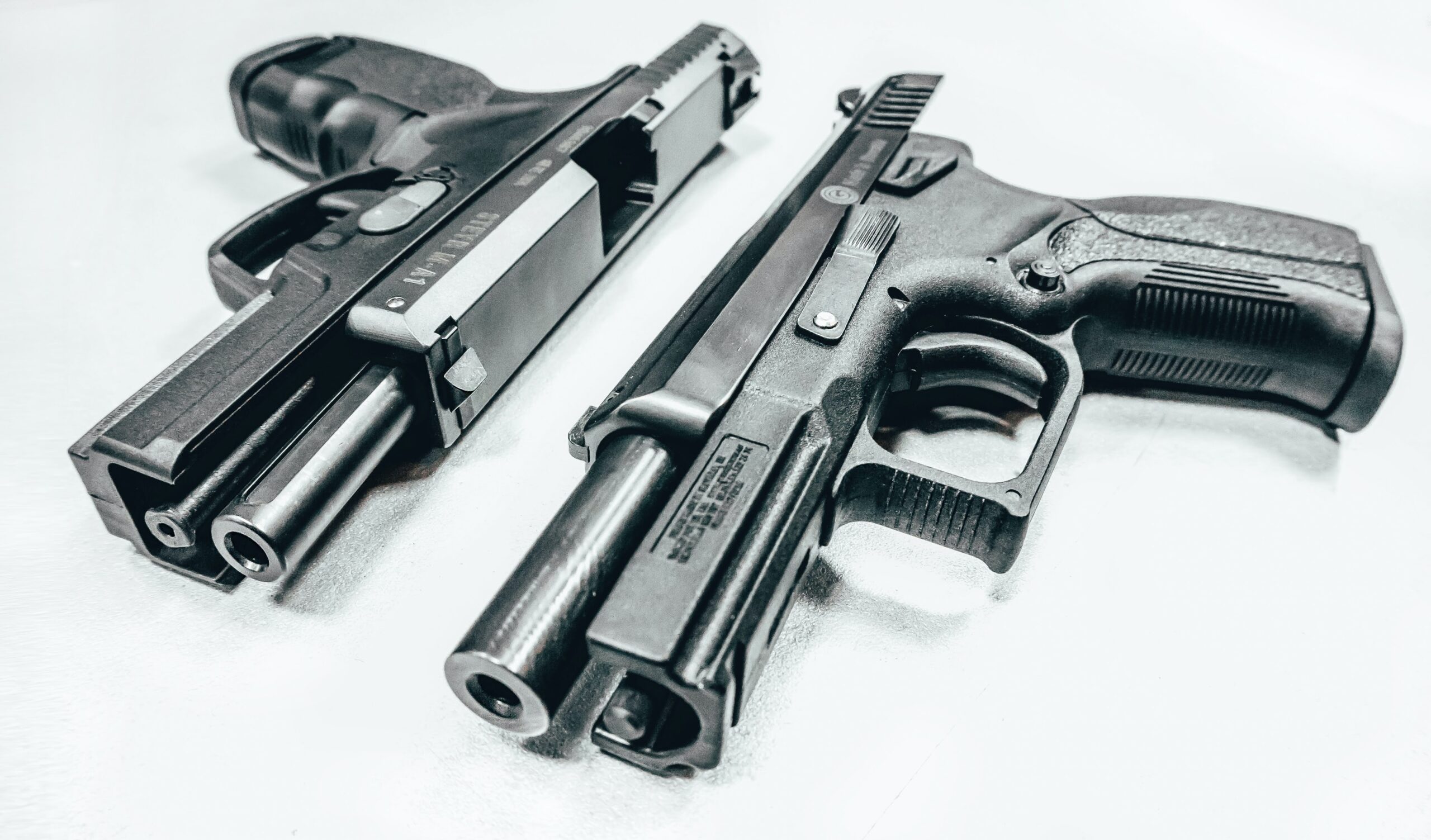 Photo of 2 silver semi-automatic firearms