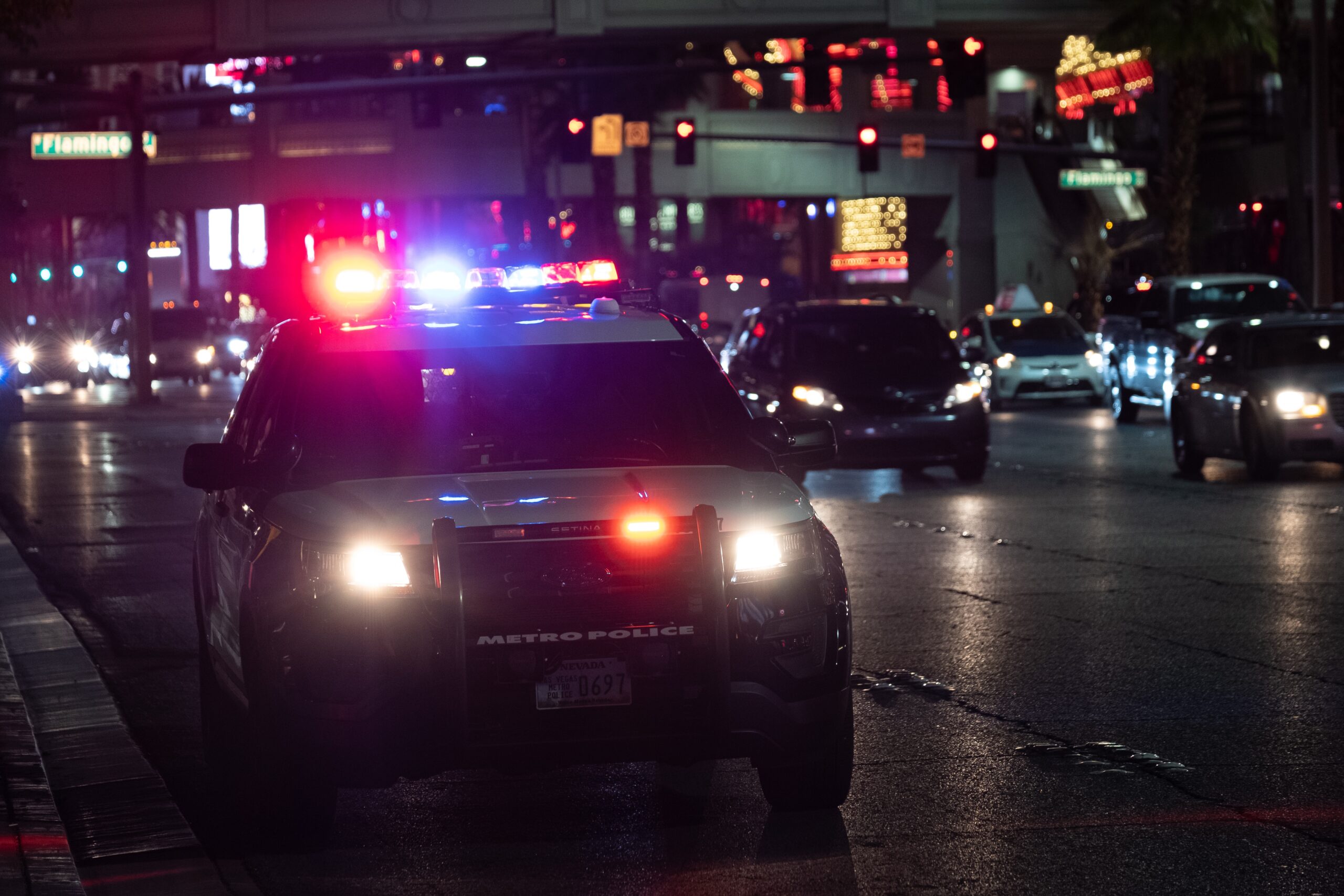 Police SUV with headlights and overhead lights on